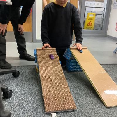Science: Friction enquiry- How does the ramp material affect how far a car will travel?