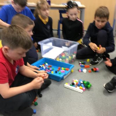 Developing our knowledge and understanding of our multiplication bonds : 9 x tables using concrete resources