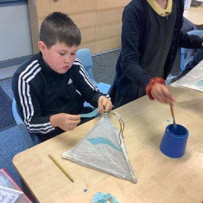 Curie making lanterns for the Christmas parade