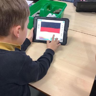 Computing: We programmed our own interactive stories and games on ScratchJr.